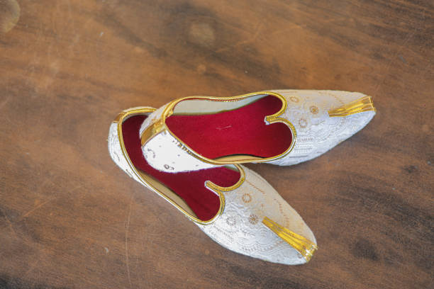 Indian Men Embroidery Mojari and Jutti Indian Punjabi Culture with Designing Indian Men Embroidery Mojari and Jutti Indian Punjabi Culture with Designing handmade indian shoes on white stock pictures, royalty-free photos & images