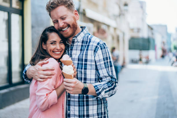 istock Lovely couple eating ice cream together. 1705503357