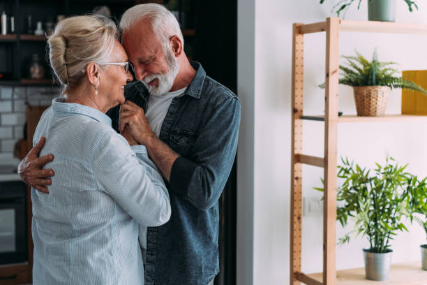 istock Couple dancing in living room. 1705503377