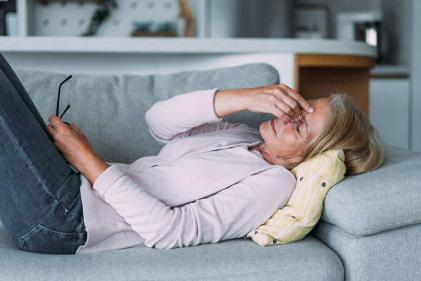Woman suffering with a migraine.