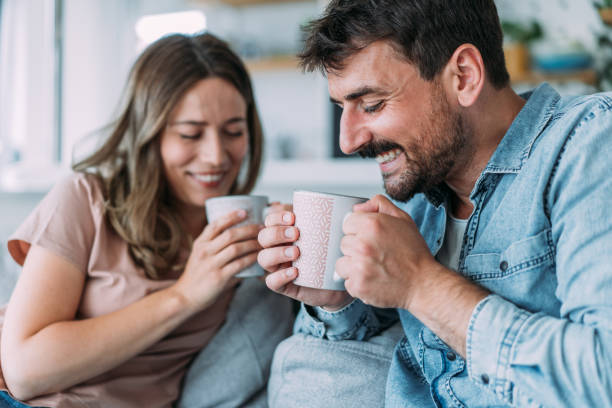 istock Lovely young couple drinking coffee at home. 1705503971