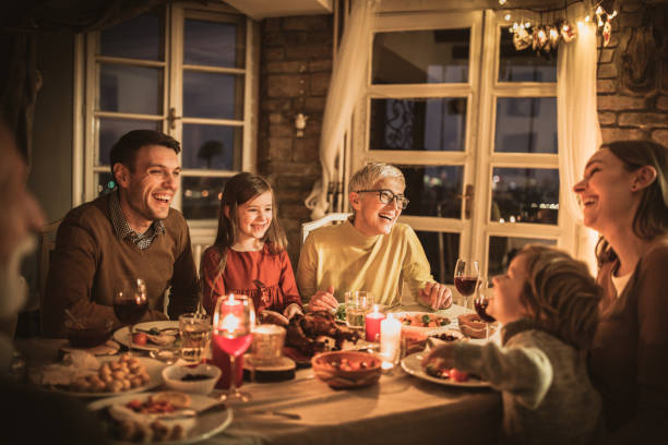 istock Cheerful multi-generation family talking during dinner at home. 1705507264