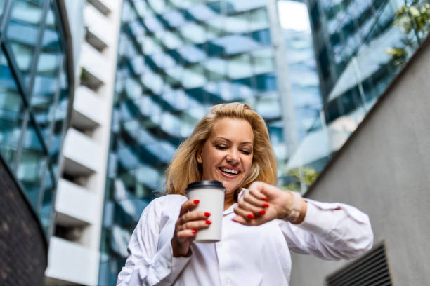 istock Businesswoman, Coffee, and Time Check 1705508677