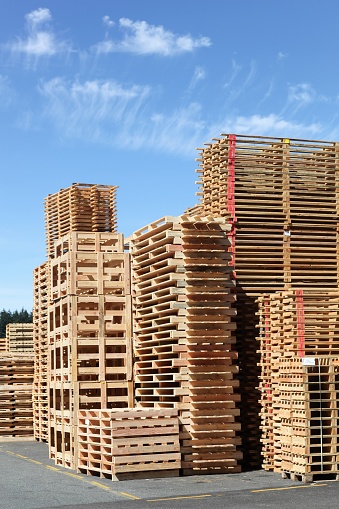Stacked wooden pallets or skids
