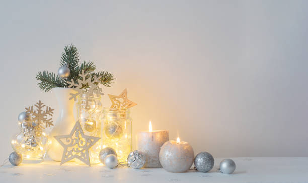 istock Christmas decoration with candles on background  white wall 1705514354