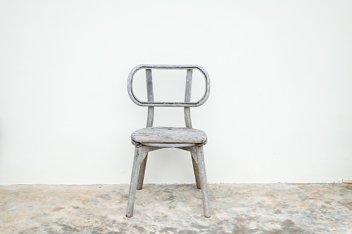 Wooden chair and white wall background