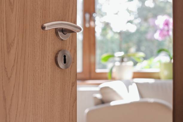 istock Half opened door into the modern cozy home interior 1705524144