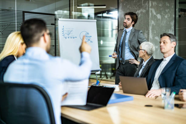 istock Young businessman leading a presentation in the office. 1705538060
