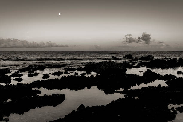 Full moon in the morning on the coast in black and white pleine lune au lever du jour sur le littoral de Corse du sud en noir et blanc image en noir et blanc stock pictures, royalty-free photos & images
