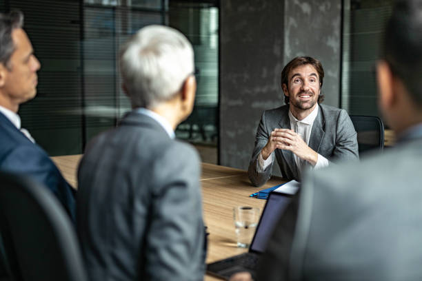 istock Happy businessman talking to human resource team on a job interview. 1705541895
