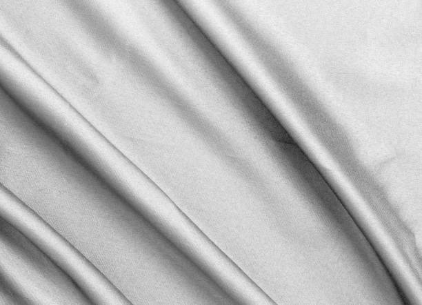 istock Smooth elegant black silk fabric or satin luxury cloth texture for abstract background 1705543153