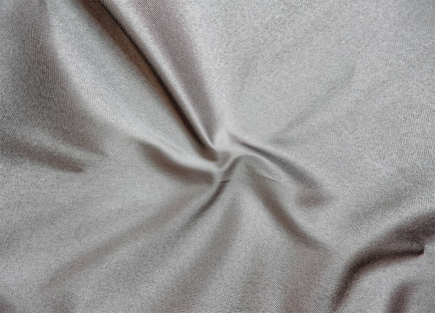 istock Smooth elegant black silk fabric or satin luxury cloth texture for abstract background 1705543159