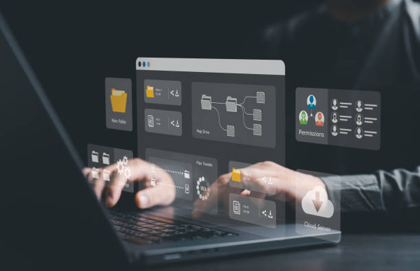 istock Businessman using laptop computer to manage document concept. Cloud backup online documentation and digital file storage software, records tracking app, Database download, upload or Permission access. 1705575023