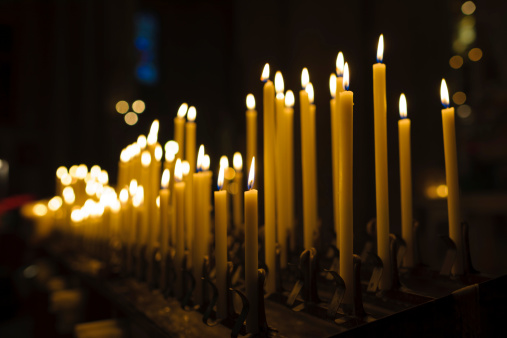 Lit Candles in Church Interior at Christmas