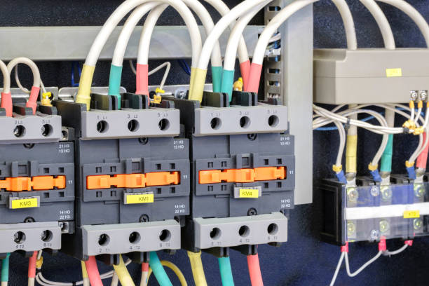 istock Close-up of Electricity distribution box with wires and circuit breakers in control room. 1705595168