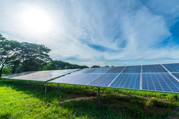 istock Photovoltaic solar power panel on dramatic sunset blue sky background, green clean Alternative power energy concept. 1705599071