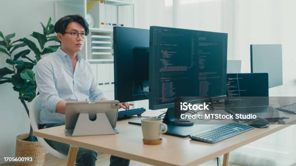 Young Asian Man Software Developers Using Computer To Write Code ...