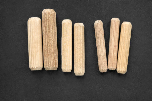 istock Wooden dowels on black 1705611773