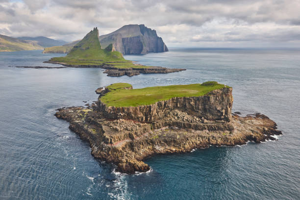 istock Faroe islands dramatic coastline viewed from helicopter. Vagar flight 1705612354