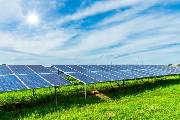 istock Photovoltaic solar power panel on dramatic sunset blue sky background, green clean Alternative power energy concept. 1705616406