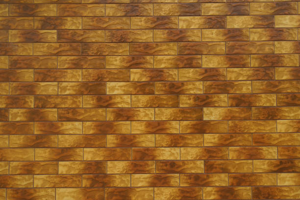 istock Background - brick like brown embossed ceramic tiles siding 1705624696