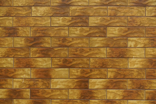istock Surface of brick like brown embossed ceramic tiles siding 1705626934