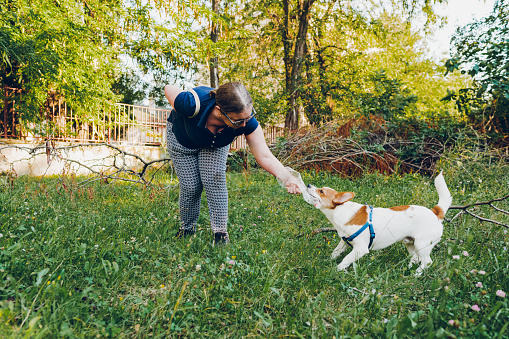 Woman playing with her dog