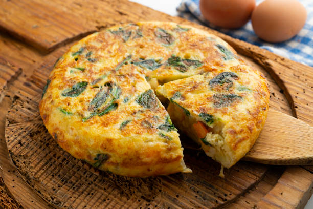 istock Spanish potato omelet with shrimp and spinach. Traditional Spanish tapa. 1705631404