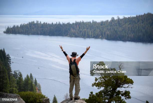 Tourist Raising Arms At Emerald Bay Lake Tahoe California Stock Photo - Download Image Now