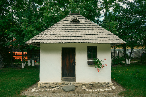 The little white house with the window with flowers. Romania, Transilvania. September, 22. 2023