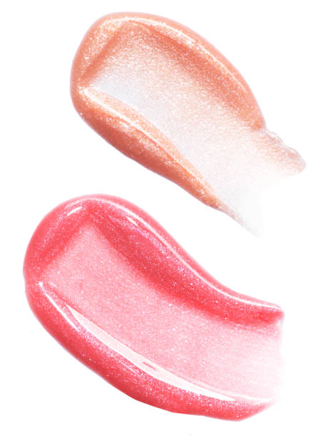 istock Pink gold lip gloss texture composition isolated on white background. Cosmetic product smear smudge swatch 1705642790