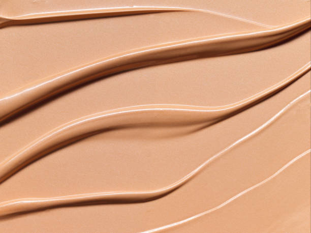 Makeup Liquid foundation composition background. BB CC Cream Concealer texture. Cosmetic product brush swatch Makeup Liquid foundation composition background. BB CC Cream Concealer texture. Cosmetic product brush swatch foundation make up stock pictures, royalty-free photos & images