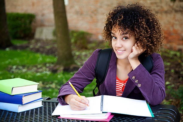 istock Attractive woman doing her homework 170564446