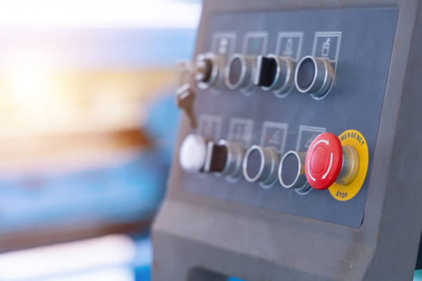 istock Emergency push button on machine dashboard in factory or industrial plant. Occupational and safety concept. 1705660507