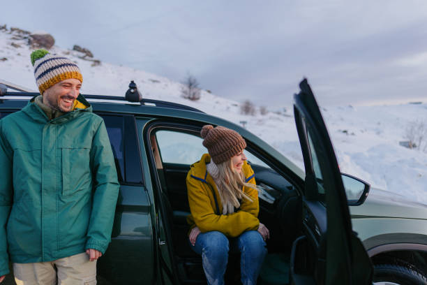 istock Smiling couple enjoy winter road trip 1705686745