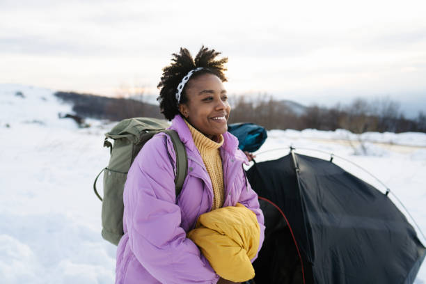 istock Young woman camping in a tent 1705686760