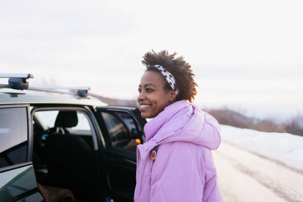 istock Young woman on a winter road trip 1705686870