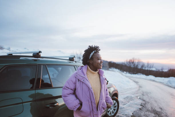 istock Young woman on a winter road trip 1705687215