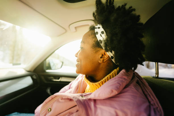 istock Young woman riding in the car 1705689131