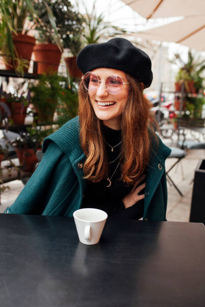 istock Stylish woman sitting in cafe 1705692725