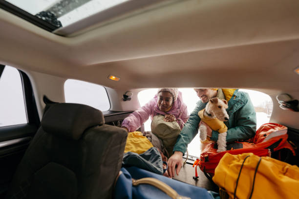 istock Smiling couple preparing for a snowy hike 1705696029