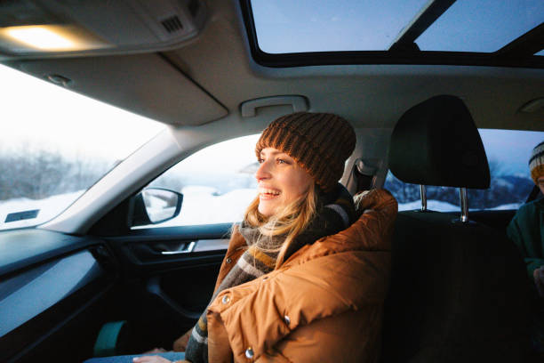 Young woman riding in the car