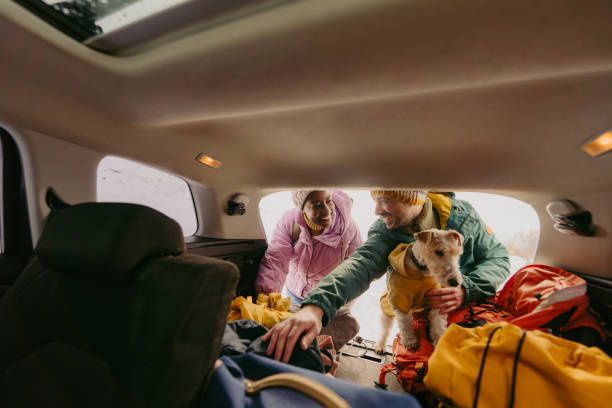 istock Smiling couple preparing for a snowy hike 1705696038