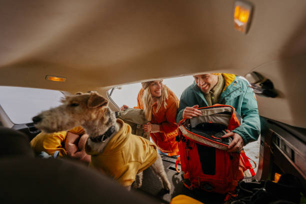 istock Smiling couple preparing for a snowy hike 1705696054