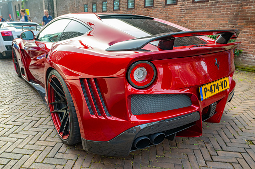Ferrari F12 Novitec N Largo S sports car in the streets of Zwolle. The Novitec N Largo S is based on the Ferrari F12 Berlinetta and equiped with a high performand V12 engine and a widebody with components made from the hitech material carbon. NOVITEC builds the N-LARGO S high-performance sports car in a select limited edition.