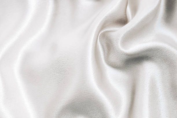 istock Silvery smooth silk texture of beauty silk 1705744064