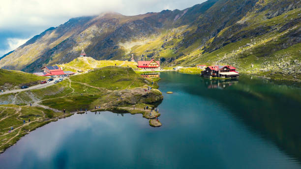 Aerial top down view Balea mountain lake. Romania Transfagarash. Shot on drone. Famous tourism travel destination Aerial top down view Balea mountain lake. Romania Transfagarash. Shot on drone. Famous tourism travel destination. balea lake romania stock pictures, royalty-free photos & images