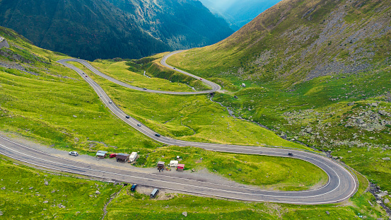 Aerial top down view Transfagarash mountain curve highway road. Romania Transilvania. Shot on drone. Famous tourism travel destination.