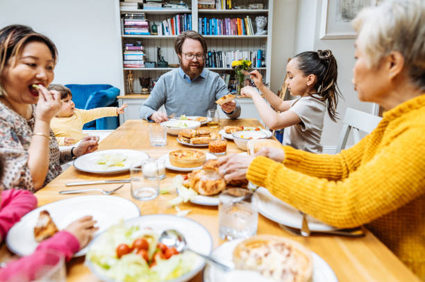 istock Multi-generation Asian family enjoying lunch together at home 1705756049