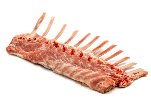istock Lamb rack cutlet isolated on white background. Raw lamb chops with herbs and spices 1705764545